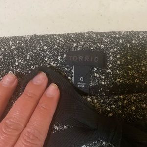 A-line, mini skirt with pockets and tie belt.  Elastic waistband